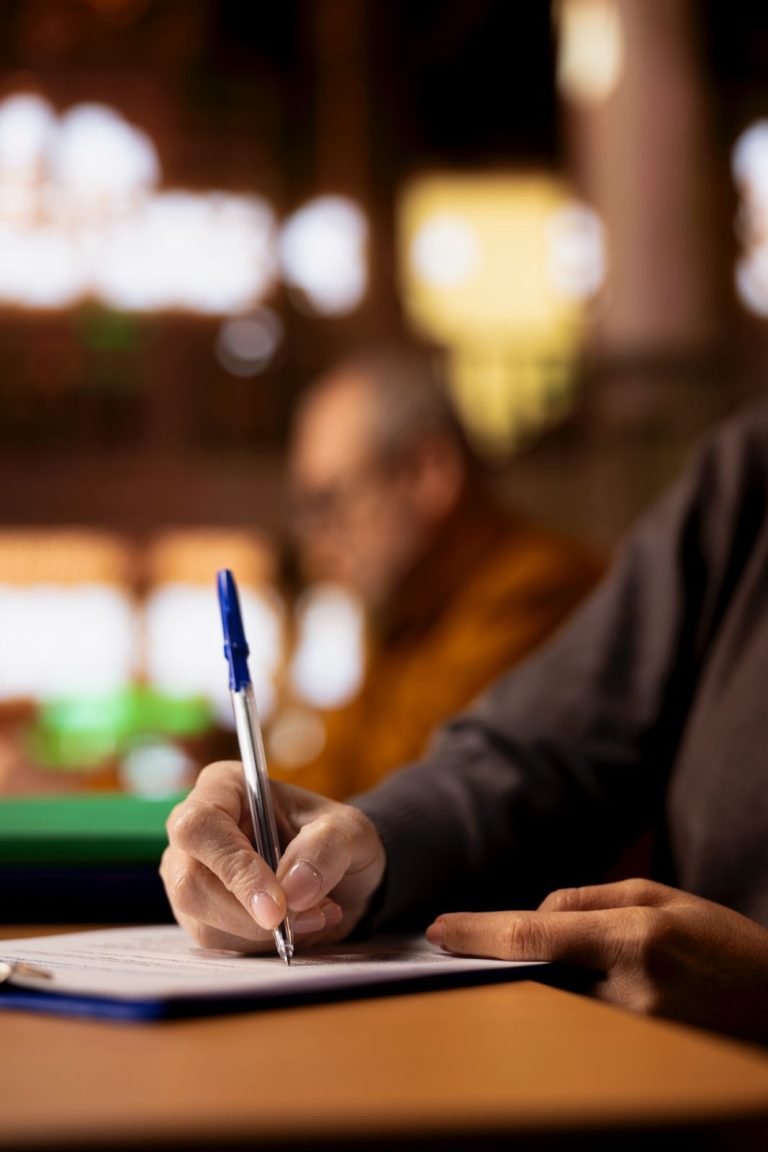 Person writing notes during a coaching session