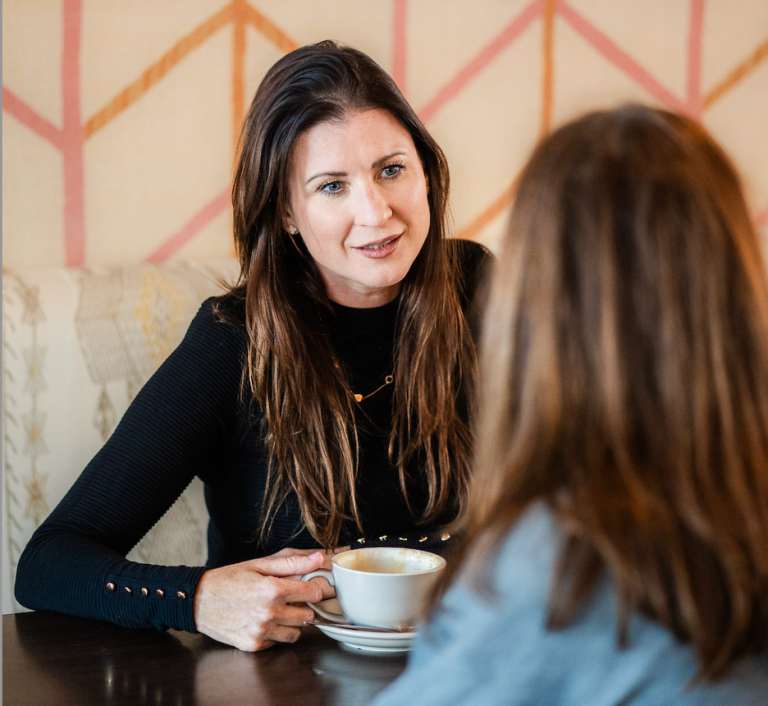 Ursula Crilly in a coaching conversation over coffee